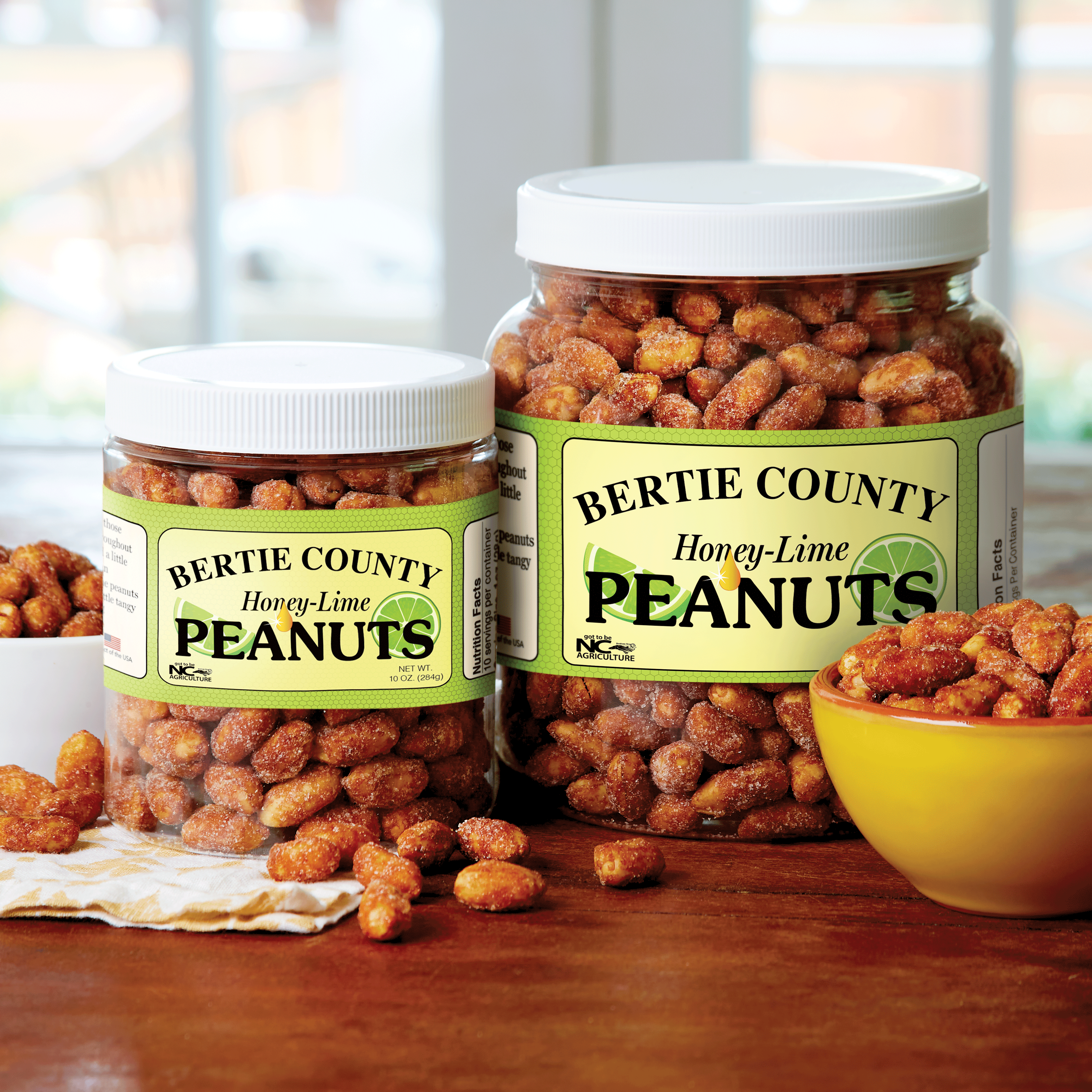 Two jars filled with honey lime peanuts